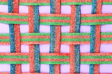 tatlı Jöleli şeker pembe bir arka plan üzerinde