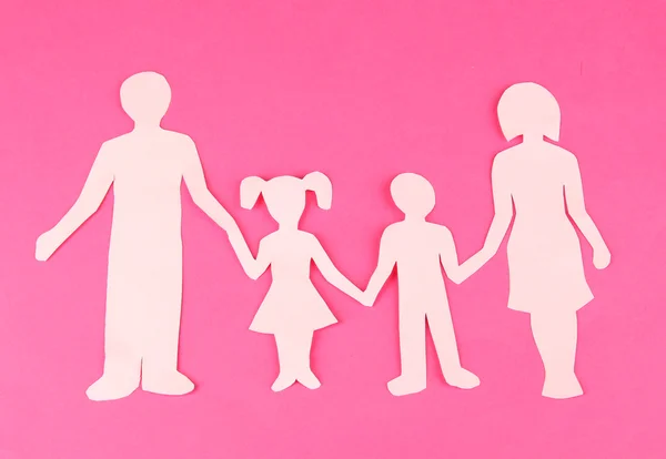 Family from paper on bright background — Stock Photo, Image