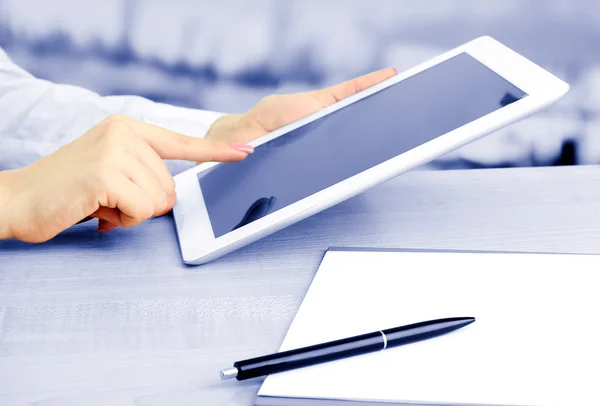 Female office worker using digital tablet in cafe in shades of grey — Stock Photo, Image