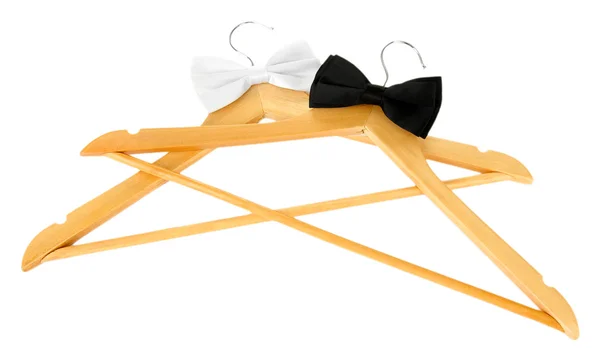 Black and white bow ties on wooden hangers, isolated on white — Stock Photo, Image