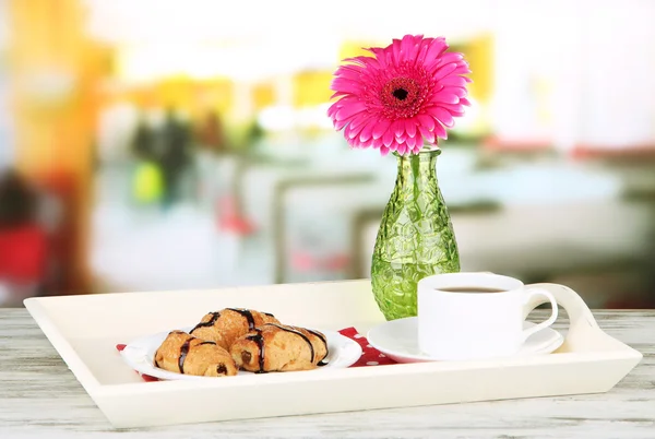 Wooden tray with breakfast, on bright background — Stock Photo, Image