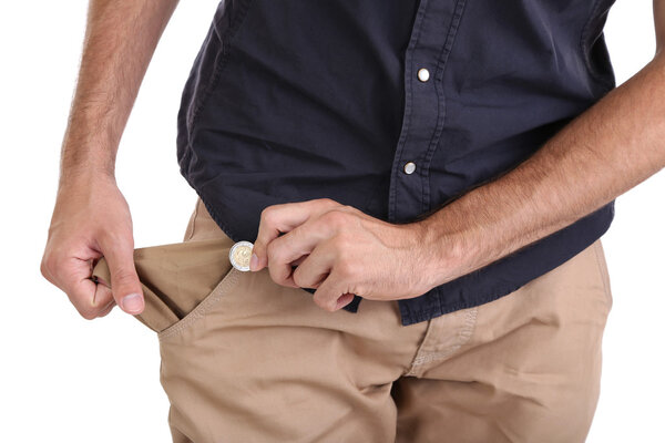 Man showing his empty pocket, isolated on white