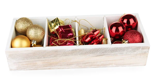 Wooden box filled with christmas decorations, isolated on white Royalty Free Stock Images