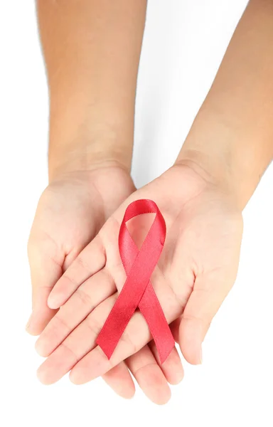 AIDS ribbon in hands isolated on white — Stock Photo, Image