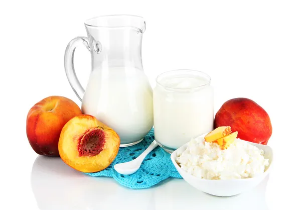 Fresh dairy products with peaches isolated on white — Stock Photo, Image