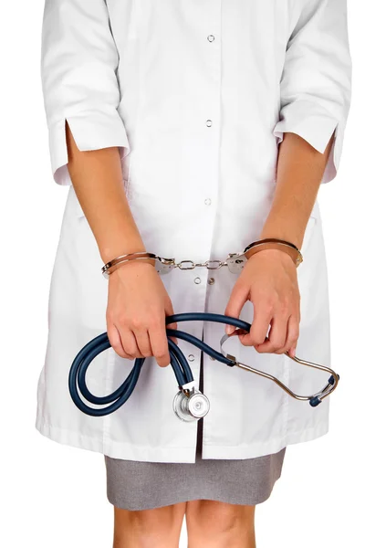 Arts met een stethoscoop in handboeien geïsoleerd op wit — Stockfoto