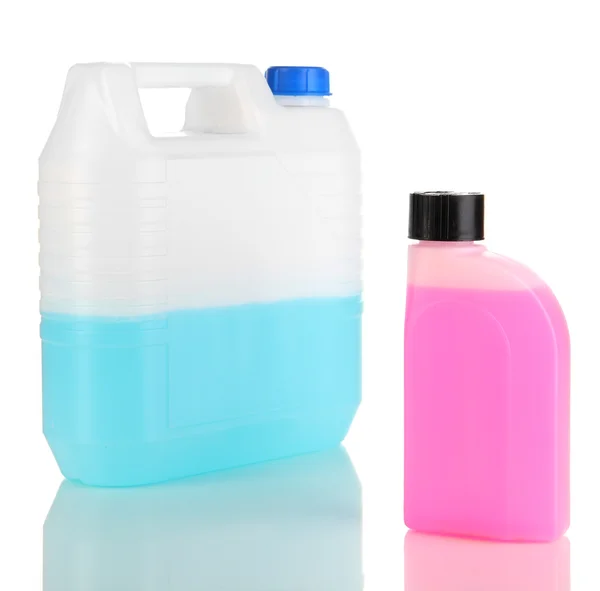 Blue and pink liquids for car in canisters isolated on white — Stock Photo, Image