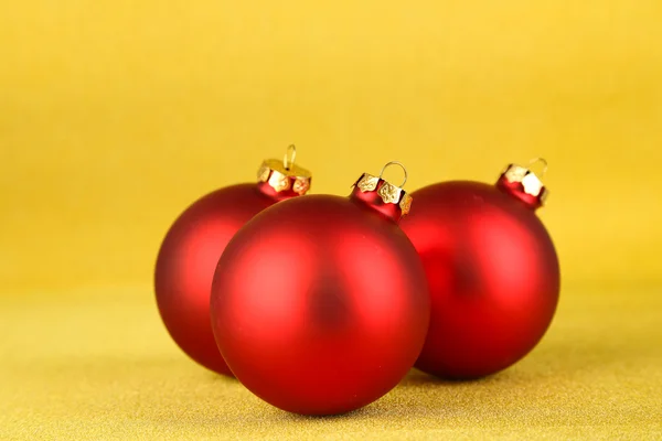 Christmas balls on yellow background — Stock Photo, Image