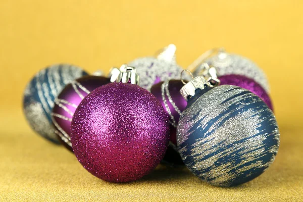 Christmas balls on yellow background — Stock Photo, Image