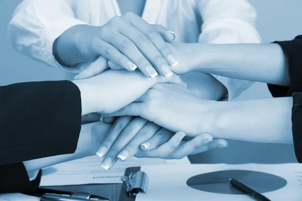 Close up of business people hands during teamwork in shades of grey — Stock Photo, Image