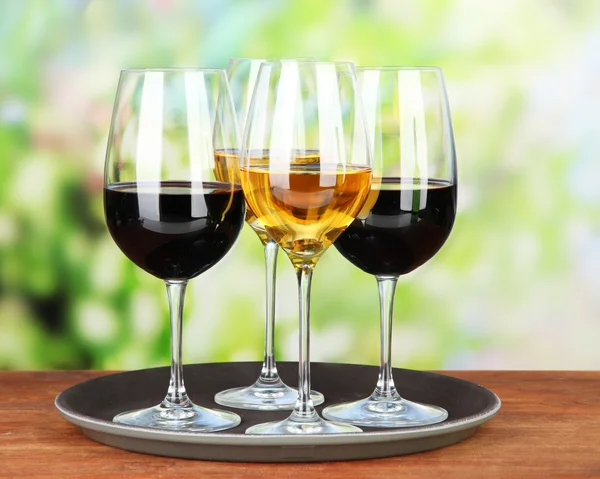 Glasses of wine, on bright background — Stock Photo, Image