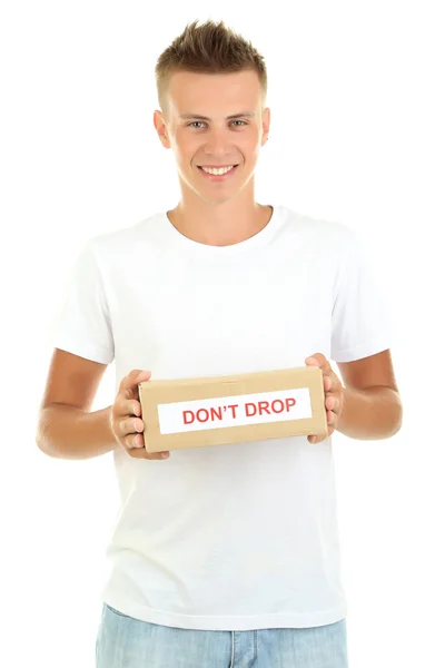 Young delivery man holding parcel, isolated on white — Stock Photo, Image
