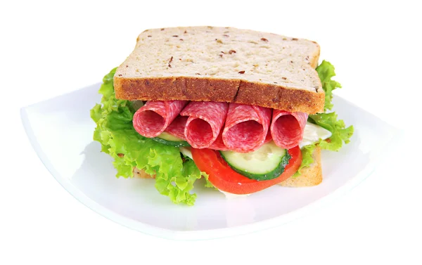 Tasty sandwich with salami sausage and vegetables on white plate, isolated on white — Stock Photo, Image