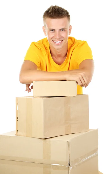 Young delivery man with parcels, isolated on white — Stock Photo, Image