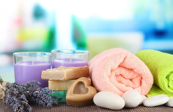 Still life with lavender candle, soap, massage balls, soap and fresh lavender, on bright background — Stock Photo, Image