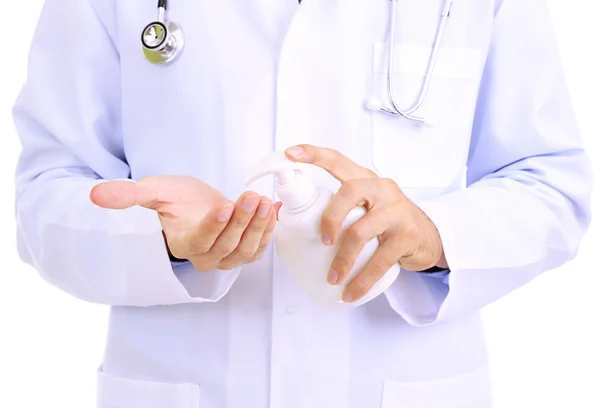 Medical doctor using sanitizer dispenser — Stock Photo, Image