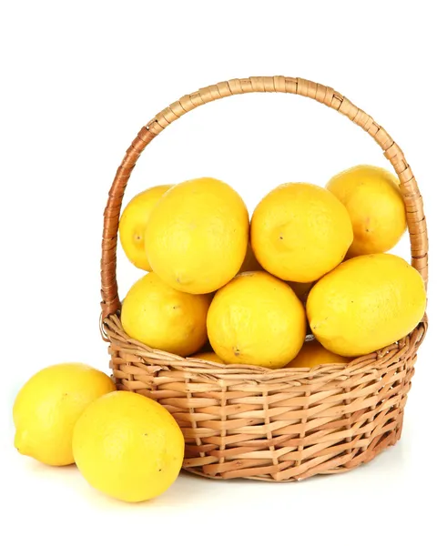 Ripe lemons in wicker basket isolated on white — Stock Photo, Image