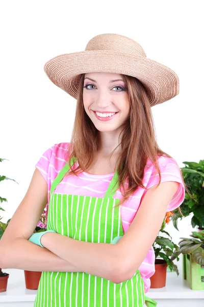 Bella ragazza giardiniere con fiori isolati su bianco — Foto Stock