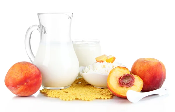 Fresh dairy products with peaches isolated on white — Stock Photo, Image