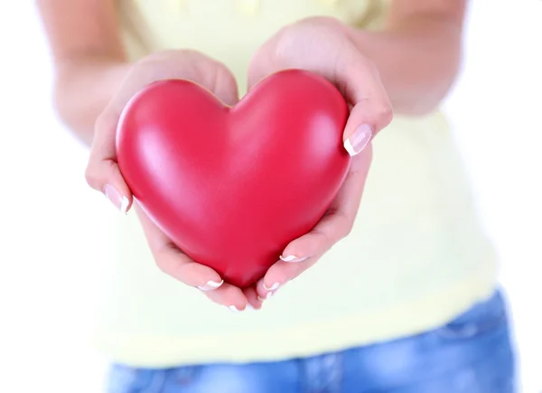 Coração em mãos de menina isolada em branco — Fotografia de Stock