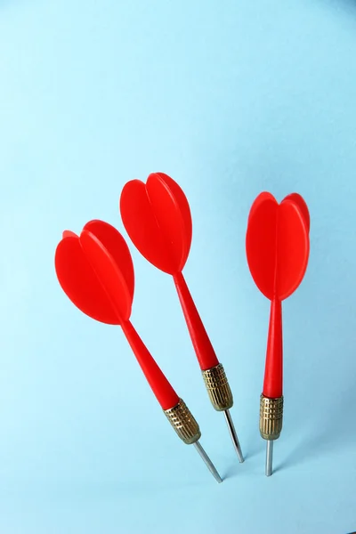 Darts on blue background — Stock Photo, Image