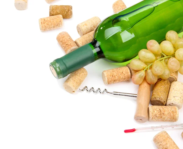 Bottle of wine, grapes and corks, isolated on white — Stock Photo, Image