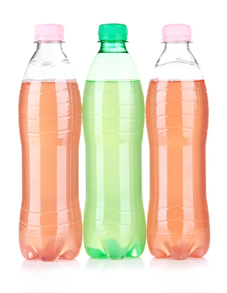 Flasker med velsmagende drikkevarer, isoleret på hvid - Stock-foto