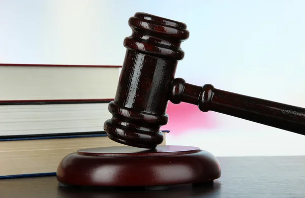 Gavel and books on table on light background — Stock Photo, Image