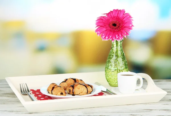 Wooden tray with breakfast, on bright background — Stock Photo, Image