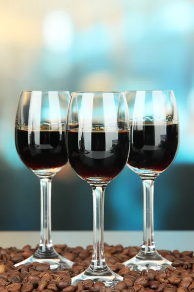 Glasses of liquor, on bright background — Stock Photo, Image
