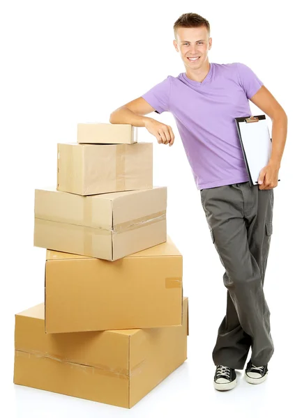 Young delivery man with parcels, isolated on white — Stock Photo, Image