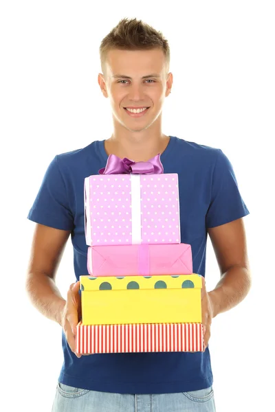 Young man holding gifts, isolated on white — Stock Photo, Image