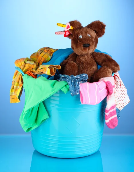 Laundry basket on blue background — Stock Photo, Image