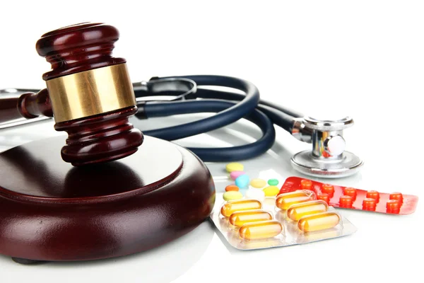 Medicine law concept. Gavel, stethoscope and pills isolated on white — Stock Photo, Image