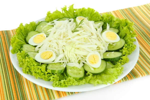 Delicious salad with eggs, cabbage and cucumbers, isolated on white — Stock Photo, Image
