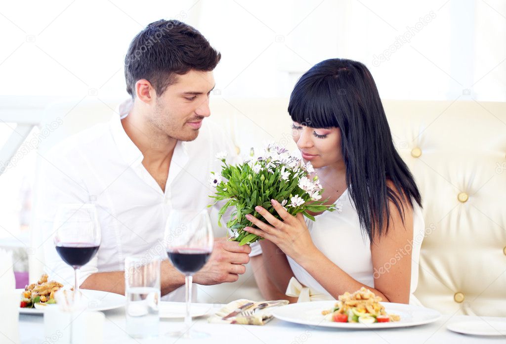 Beautiful couple having romantic dinner at restaurant