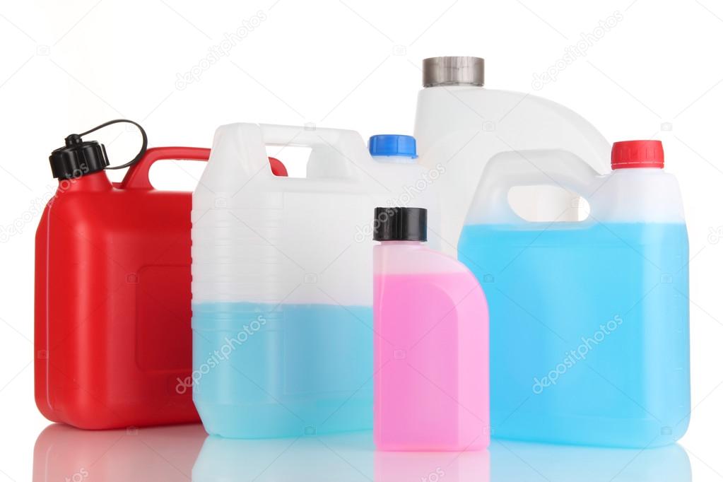Different liquids for car in canisters isolated on white