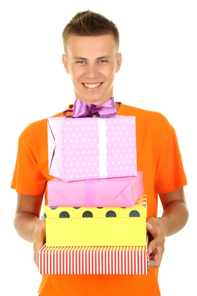Молодий чоловік тримає подарунки, ізольований на білому — стокове фото