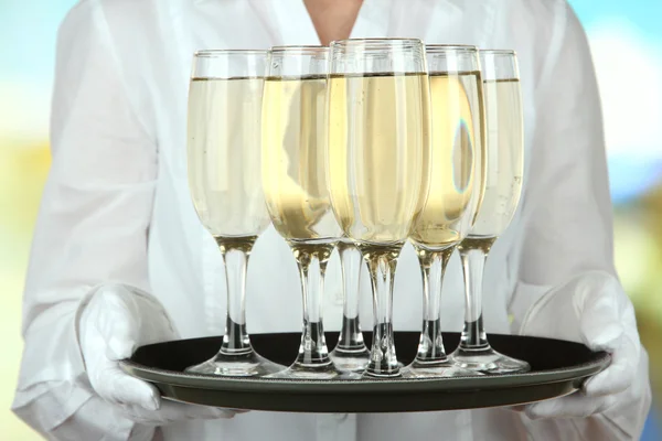 Waitresses holding tray with glasses of champagne — Stock Photo, Image