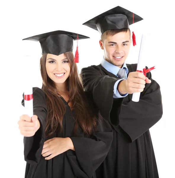 Twee gelukkige afstuderen studenten geïsoleerd op wit — Stockfoto