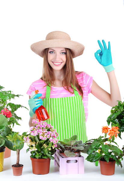 Beautiful girl gardener with flowers isolated on white