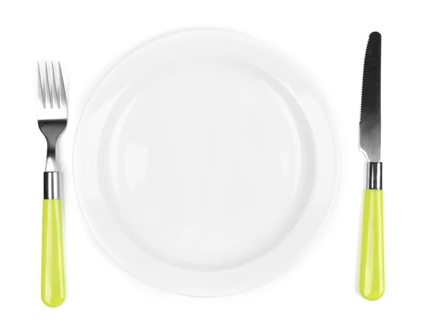 Cuchillo, placa de color y tenedor, aislado en blanco — Foto de Stock