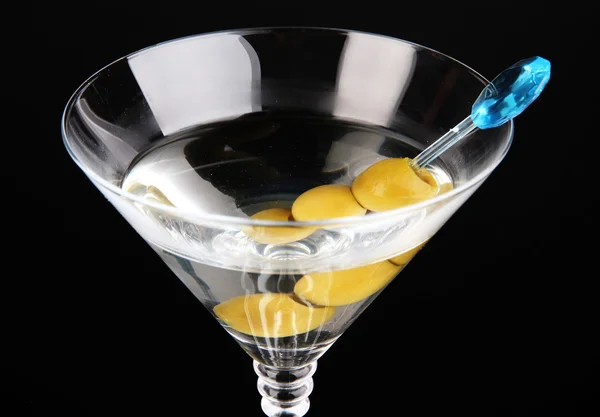 Martini with green olives on black background — Stock Photo, Image