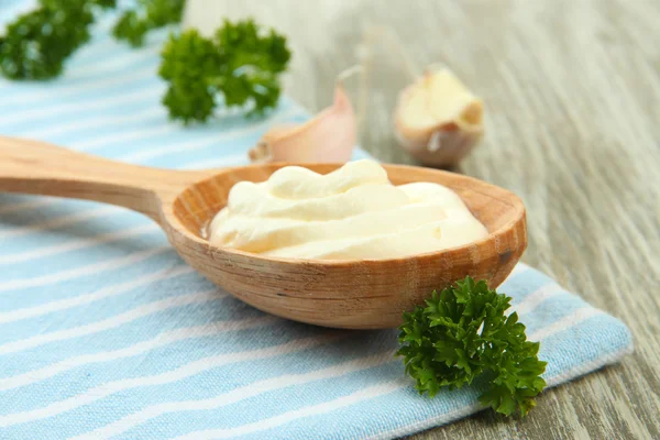 Sour cream in spoon on table close-up — Stock Photo, Image