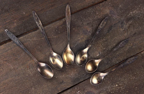 Vintage metal spoons on wooden table close-up — Stock Photo, Image