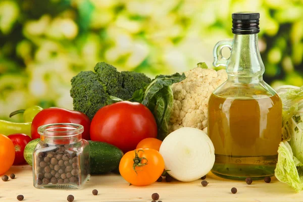 Fresh vegetables in basket on wooden table on natural background — Stock Photo, Image