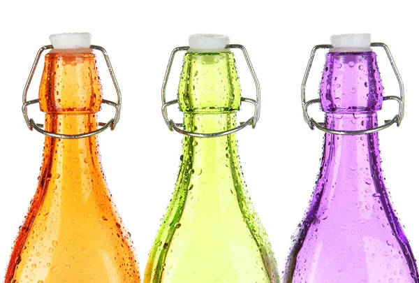 Botellas coloridas aisladas en blanco — Foto de Stock