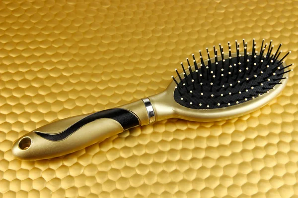 Hairbrush on color background — Stock Photo, Image