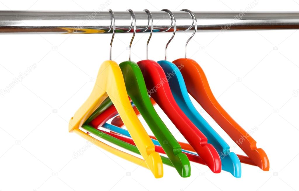 Colorful clothes hangers isolated on white Stock Photo by ©belchonock