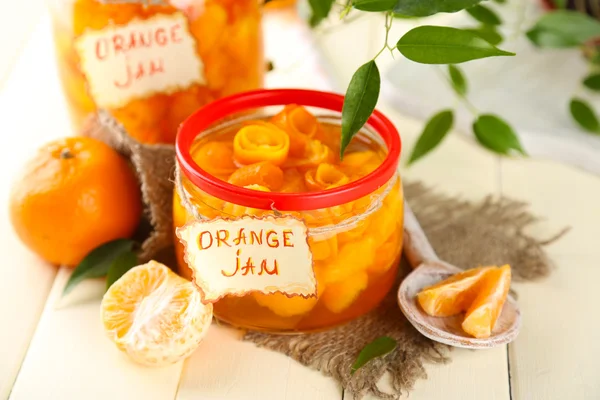 Orange jam with zest and tangerines, on white wooden table — Stock Photo, Image